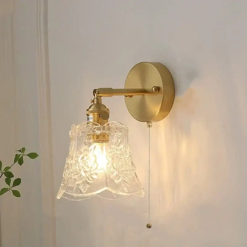 Vintage green glass led wall sconce with brass base and ornate floral etched clear glass shade for bedroom lighting