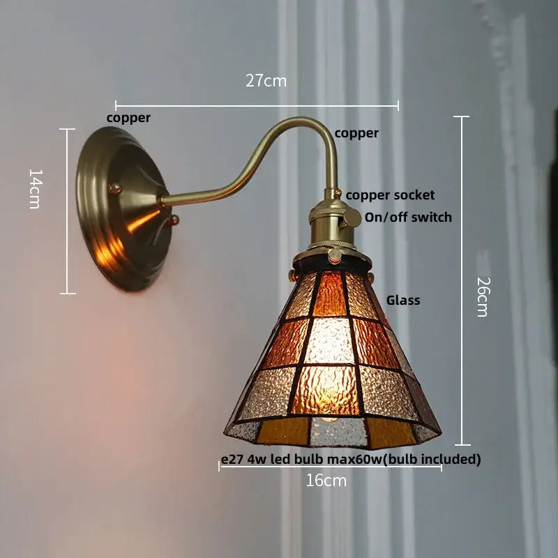 Vintage green glass led wall sconce featuring antique brass-finished copper with amber and frosted stained glass shade