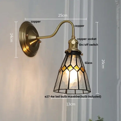 Vintage brass wall sconce with stained glass led shade featuring green glass led and amber geometric patterns