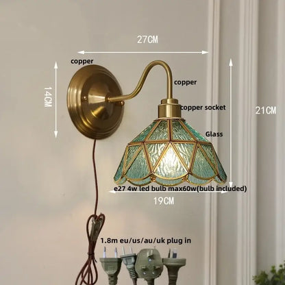 Vintage brass-finished wall sconce with green glass led teal shade featuring geometric leaded design for stair lighting