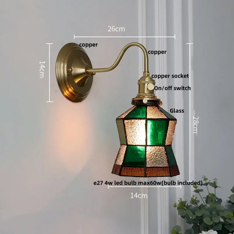 Vintage brass wall sconce with green glass led stained glass shade featuring geometric emerald and amber patterns