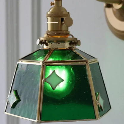 Vintage green glass led wall sconce with brass accents and diamond-shaped cutouts for stair lighting