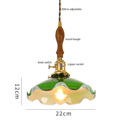 Vintage green glass pendant lamp with cream glass and wooden handle featuring brass hardware for kitchen lighting