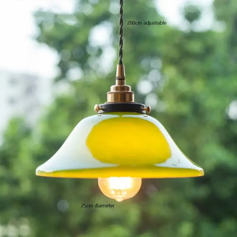 Vintage pendant lamp with gradient yellow glass shade and brass hardware suspended by adjustable 200cm cord