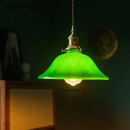 Vintage pendant lamp with green glass shade and brass hardware suitable for kitchen lighting and edison vintage pendant style
