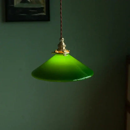 Vintage green glass pendant lamp with brass hardware and twisted brown cord ideal as an edison vintage pendant