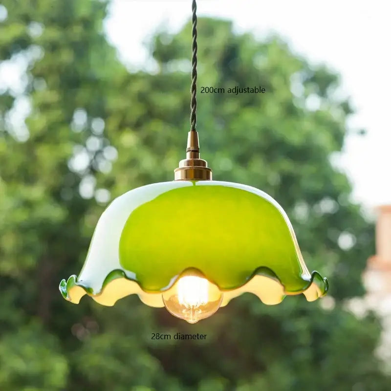 Vintage green glass pendant lamp with scalloped edge and brass hardware ideal as an edison vintage pendant