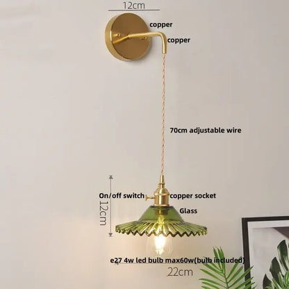 Vintage copper wall light with green glass shade and pull chain switch featuring adjustable wire for bedroom use