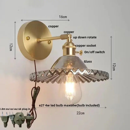 Vintage green glass wall light with copper scalloped shade and pull chain switch featuring exposed edison bulb wall light