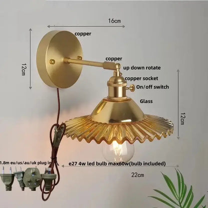 Vintage green glass wall light with brass-finished copper adjustable arm and fluted glass shade with pull chain switch