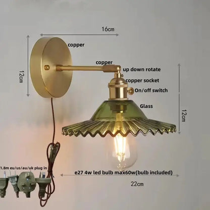 Vintage green glass wall light featuring a copper sconce with pull chain switch and exposed Edison bulb for bedroom use