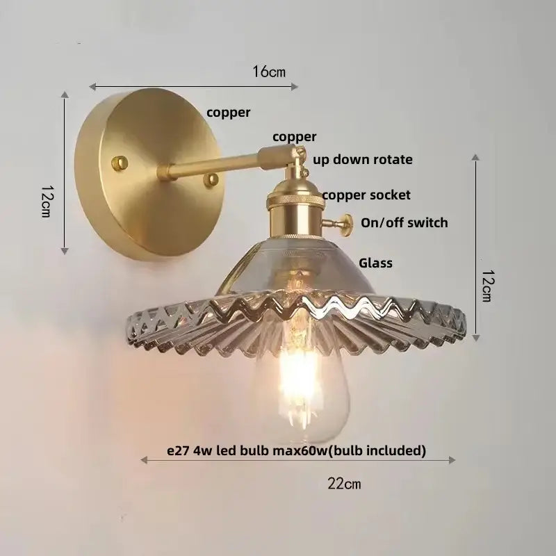 Vintage green glass wall light with brass wall sconce featuring clear scalloped shade and pull chain switch for bedroom