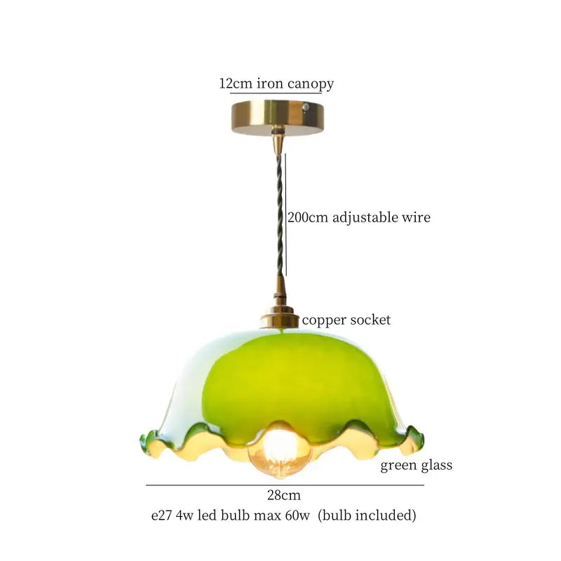 A vintage green lotus led pendant light with scalloped green glass and brass hardware for dining room use