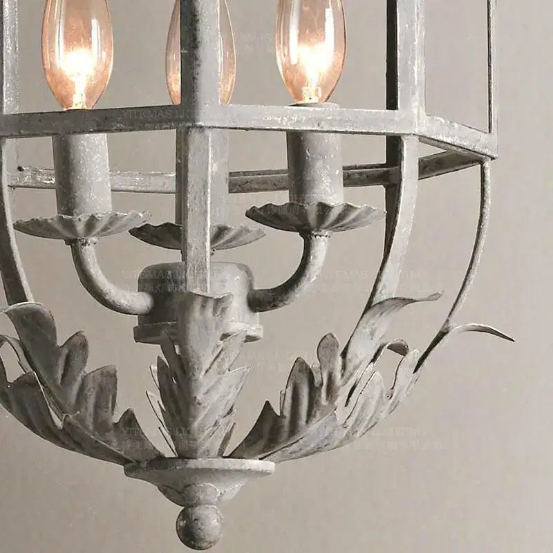 Vintage grey metal cage lantern chandelier with distressed finish and ornate leaf motif for dining room decorbites grey metal