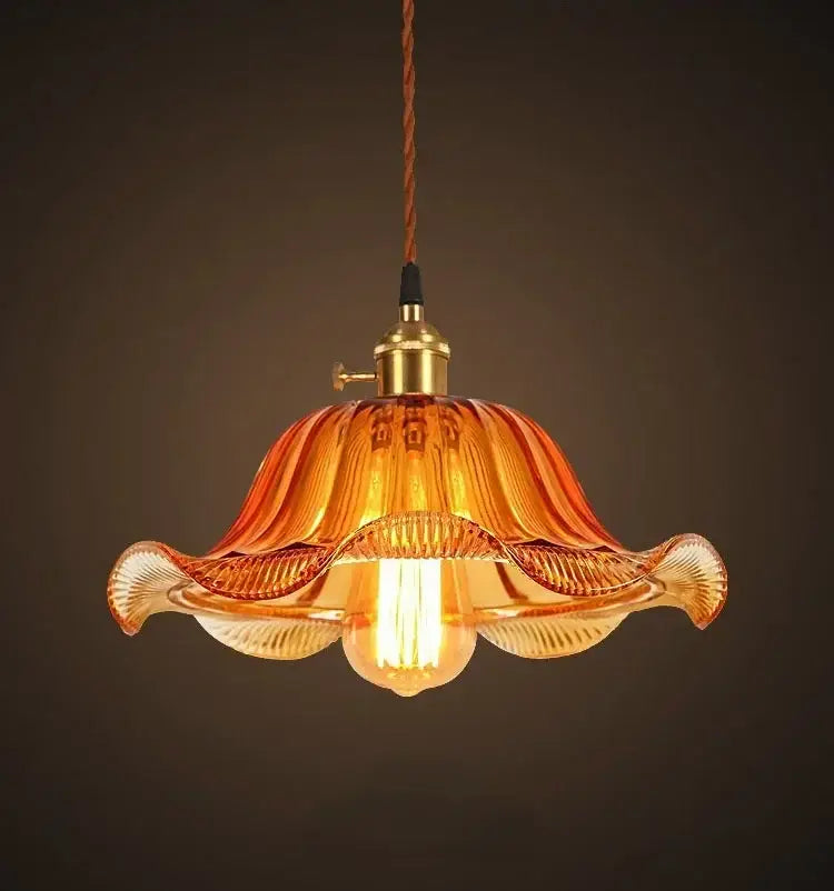 Vintage hand blown glass pendant lights featuring a warm amber fluted glass pendant with brass hardware for living rooms