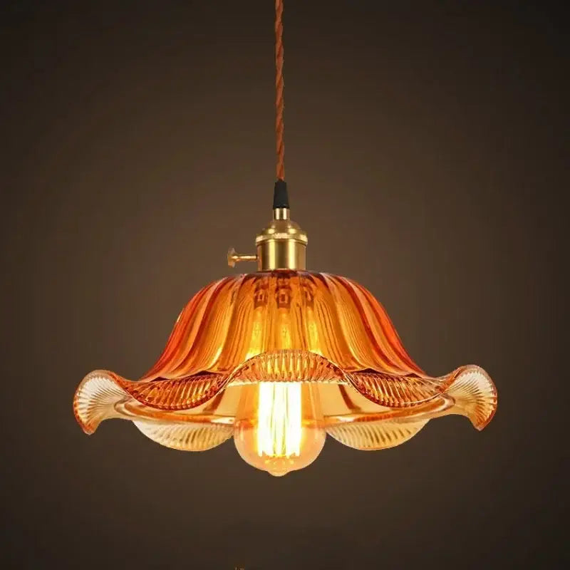 Warm amber glass pendant light with brass fixture and twisted brown cord vintage glass pendant lights for living room