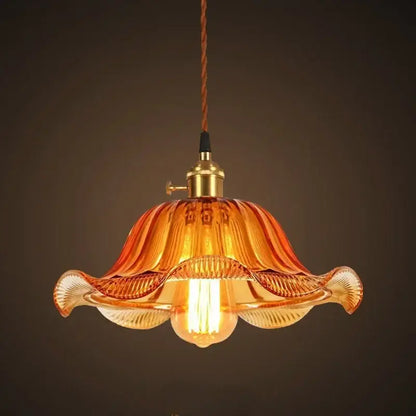 Warm amber glass pendant light with brass fixture and twisted brown cord vintage glass pendant lights for living room