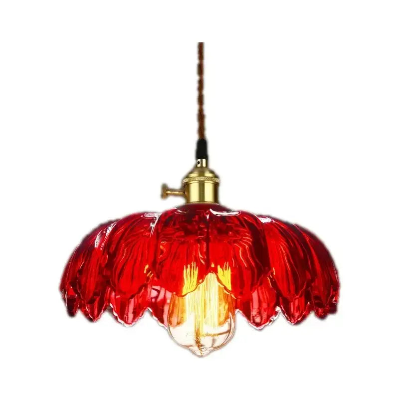 Vibrant red vintage hand blown glass pendant light with brass fixture and exposed bulb for living room use