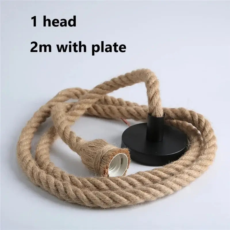 Vintage hemp rope pendant light with natural fiber cord and black base for focused lighting in dining rooms