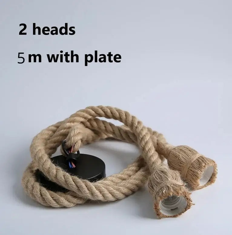 Vintage hemp rope pendant light with natural fiber rope, two exposed bulb sockets, and black mounting plate for focused lighting