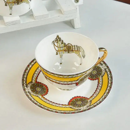 Vintage white porcelain mug cup saucer with gold handle and intricate horse illustration for dining room use