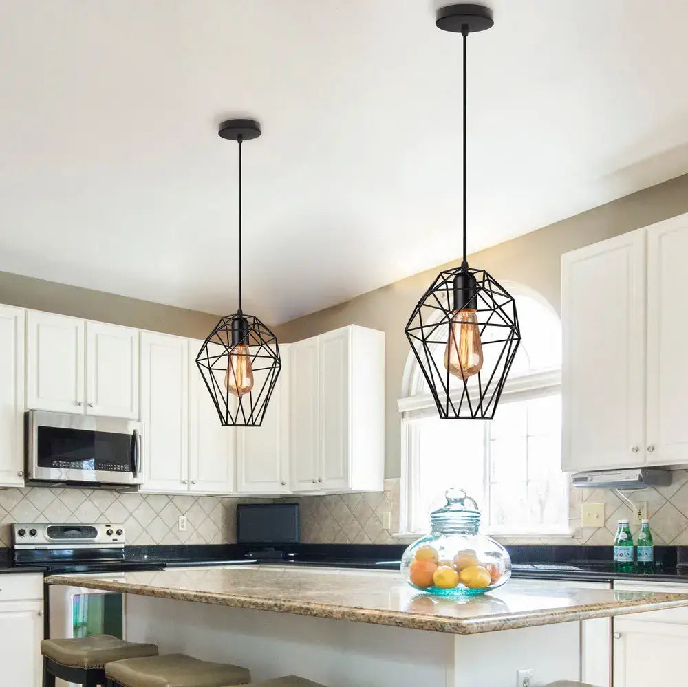 Black metal cage pendant light with exposed filament bulbs from decorbites hanging above kitchen island for lighting decor