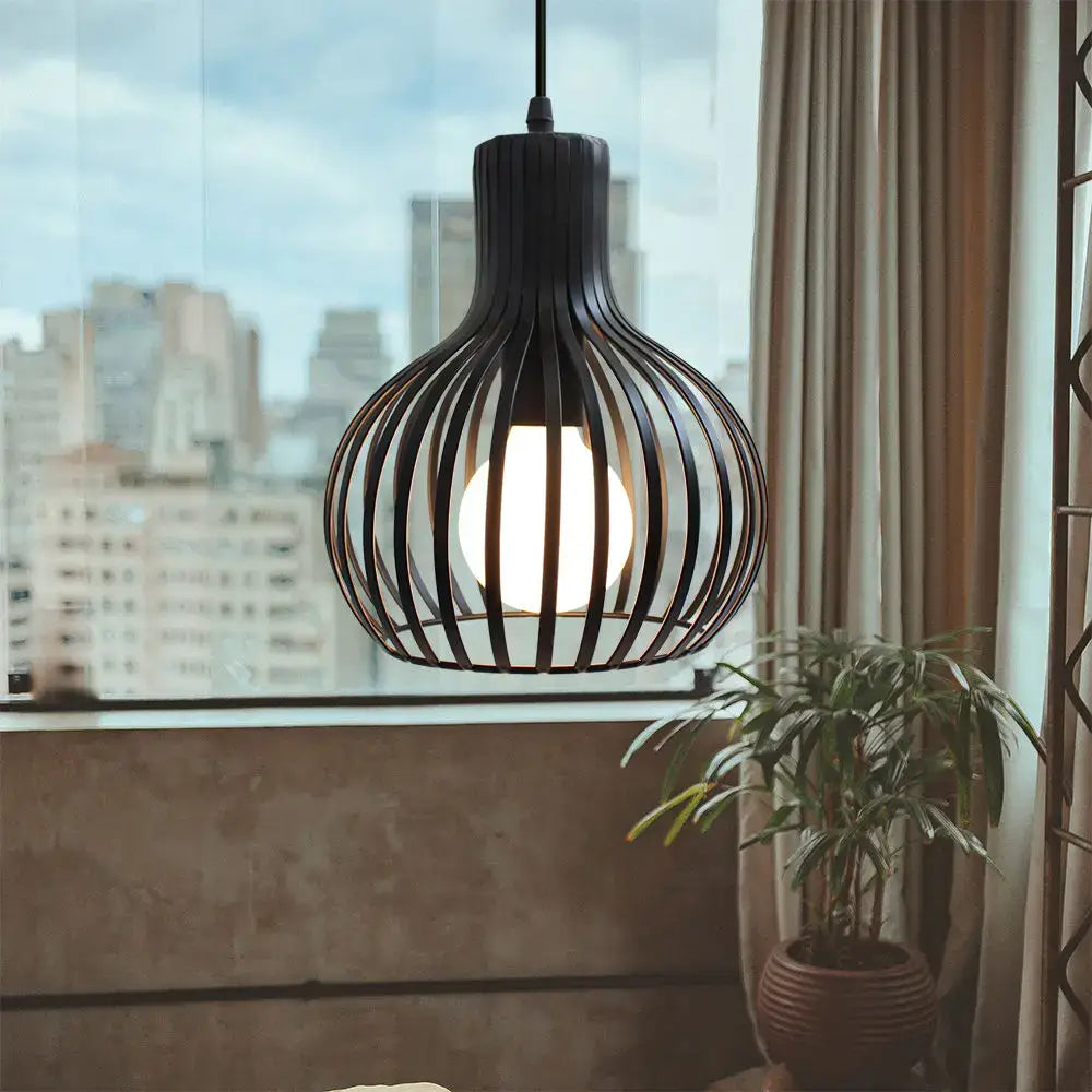 Vintage industrial black metal cage pendant light with spherical design and warm glowing bulb for kitchen decorbites black metal lighting