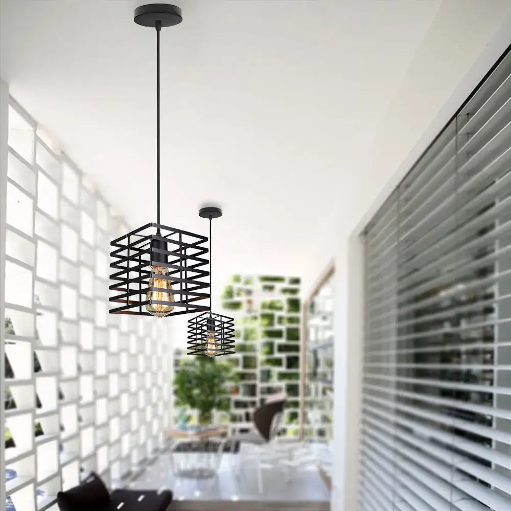 Vintage industrial black metal cage pendant light with geometric design and exposed filament bulb for kitchen decorbites black metal