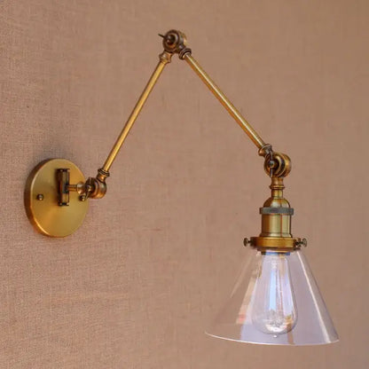 Vintage industrial brass glass ball swing arm bedroom sconce with adjustable brass arm and clear glass shade