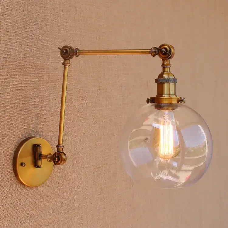 Vintage industrial brass glass ball swing arm wall sconce with clear globe and exposed filament bulb for bedroom decorbites brass glass