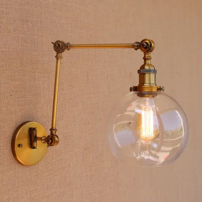 Vintage industrial brass glass ball swing arm wall sconce with clear globe and exposed filament bulb for bedroom decorbites brass glass