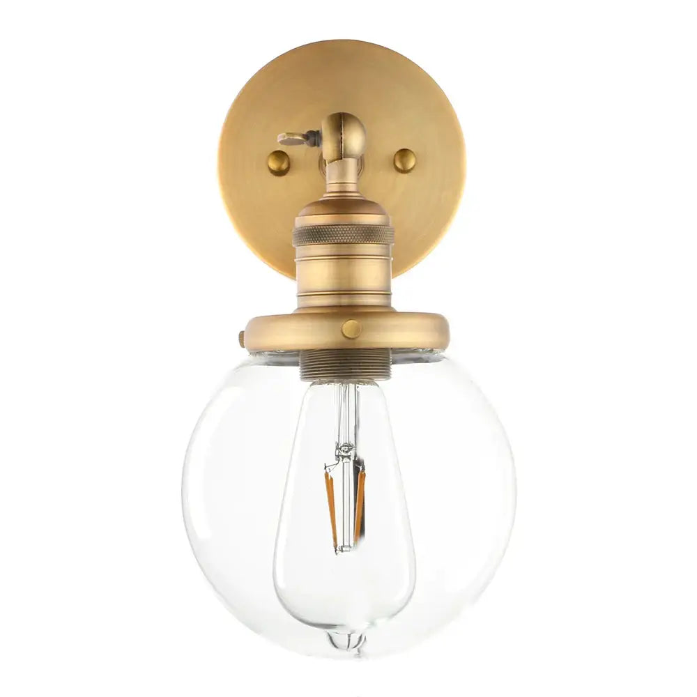 Brass-finished vintage industrial wall sconce with clear glass globe and exposed filament bulb for bedroom decorbites vintage industrial