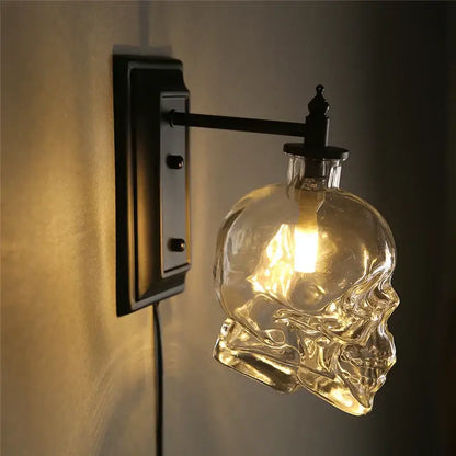 Vintage industrial glass skull wall sconce with clear glass skull lamp and black metal mounting bracket for living room use