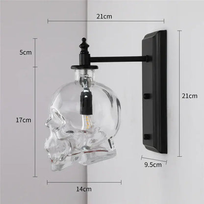 Clear glass skull wall sconce with black metal bracket vintage industrial style for living room lighting