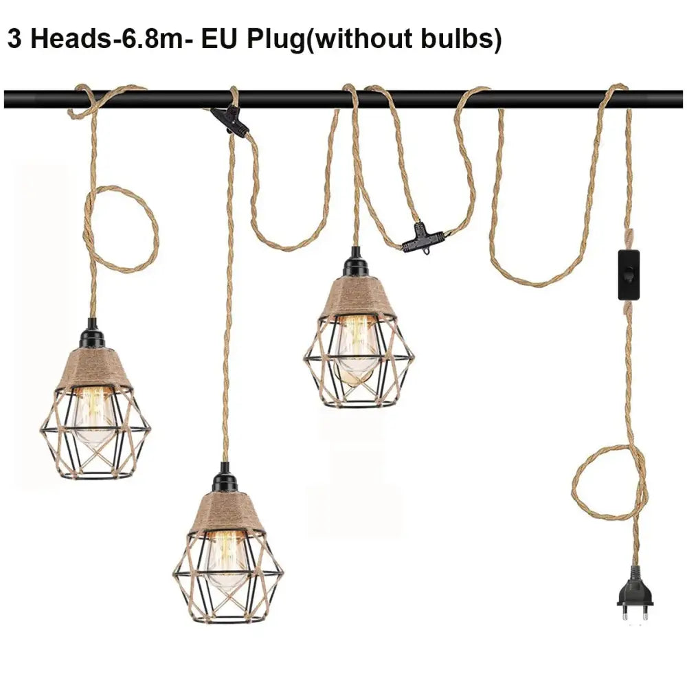 Three vintage industrial pendant lights with black metal cages and beige hemp rope cords for dining room use