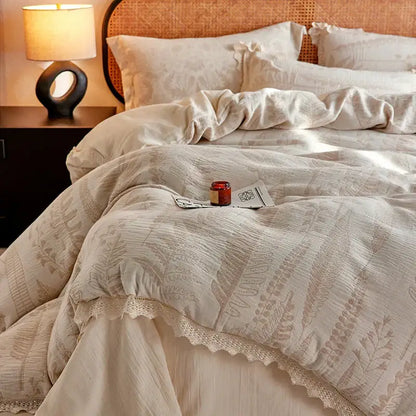 Cream-colored linen bedding set with vintage lace trim and subtle beige fern embroidery in health wrinkled yarn