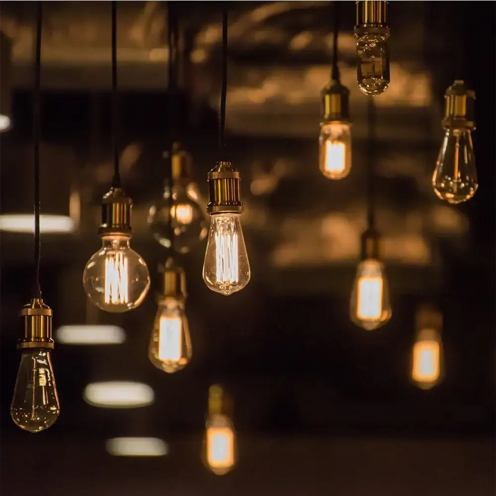 Warmly glowing vintage edison bulbs with brass sockets in decorbites led wood ceiling pendant light for dining room