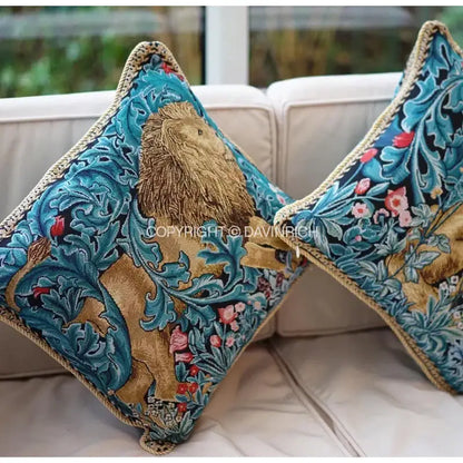 Square cushion cover with embroidered golden lion on teal floral jacquard fabric edged with braided trim for decorbites lion tapestry decor
