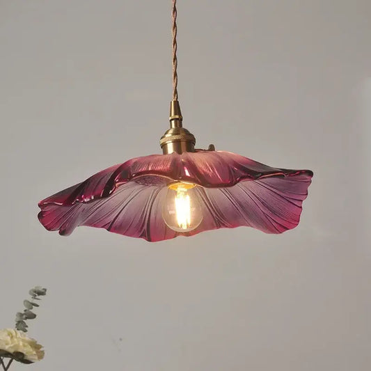 Hand-blown glass pendant light with magenta to pink gradient and leaf ridges featuring led bulb for bedroom use