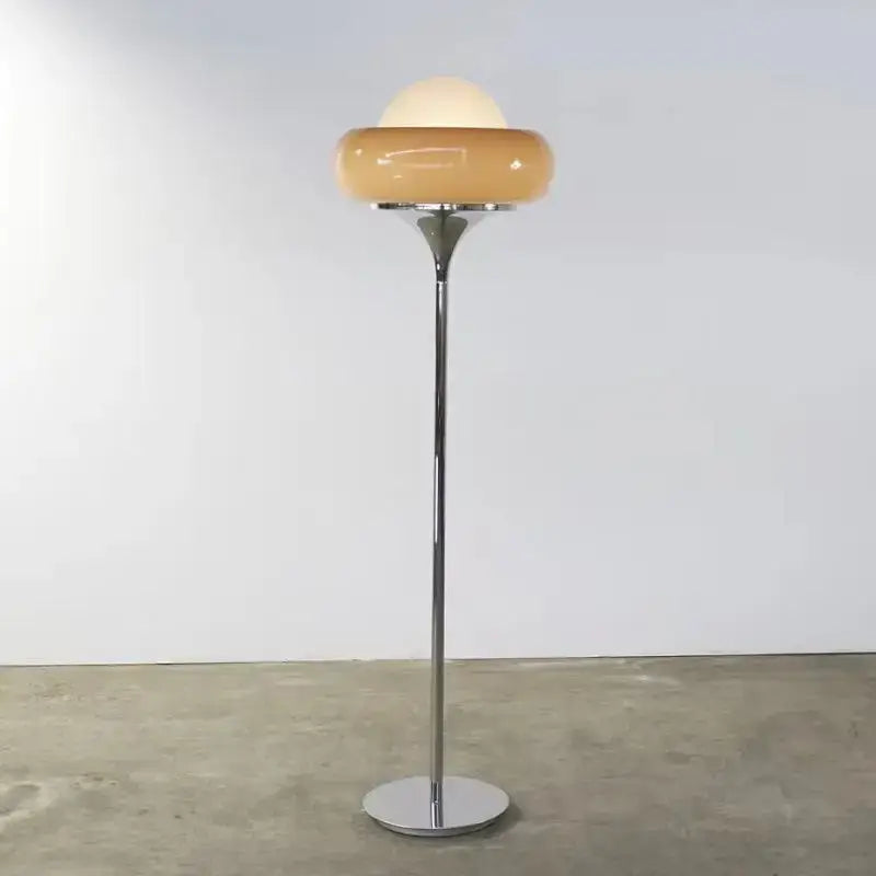 A sleek vintage table lamp with amber glass shade and chrome base for bedroom lighting