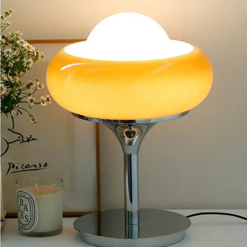 Vintage table lamp with warm amber glass shade and sleek chrome base ideal for bedroom lighting