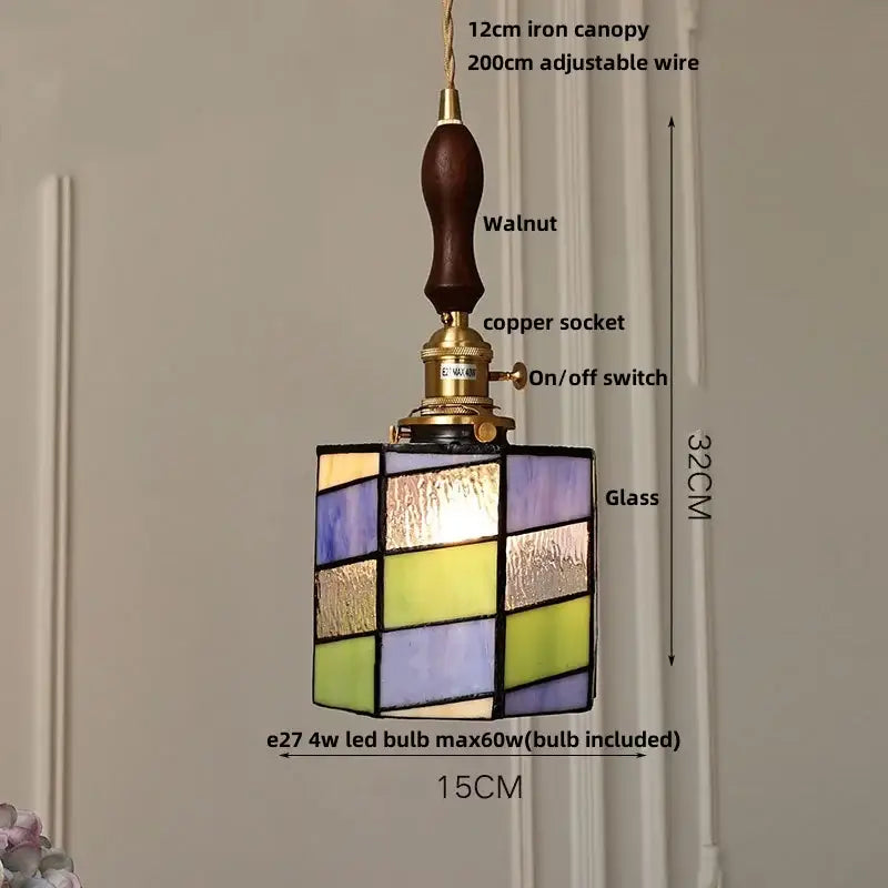 Vintage pale blue enamel pendant light with ceramic knob switch and square stained glass panels in purple and gold accents