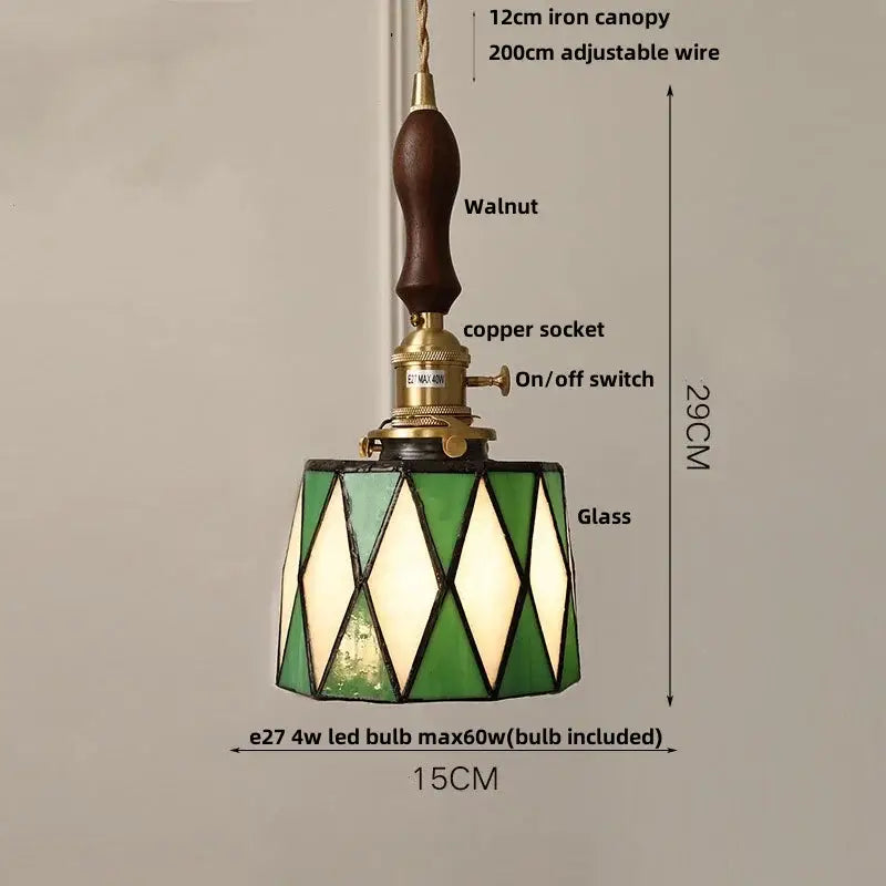 Vintage pale blue enamel pendant light with ceramic knob switch featuring a green and white stained glass shade and walnut canopy