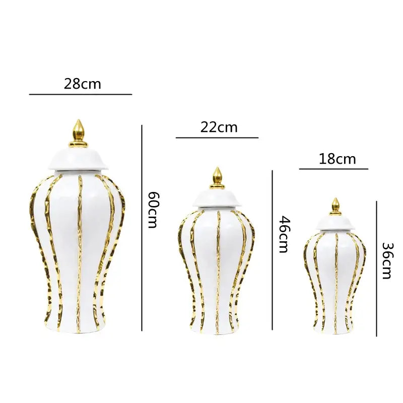 Three elegant vintage porcelain vases with gold rim detailing and lids featuring a fluted design for living room decor