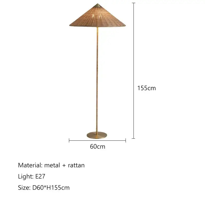 Tall slender floor lamp with a gubi rattan shade and brass pole, perfect for vintage living room decorbites gubi rattan