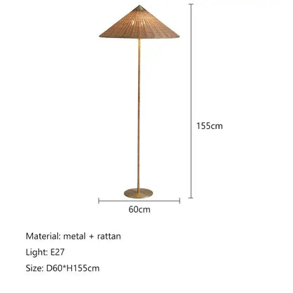 Tall slender floor lamp with a gubi rattan shade and brass pole, perfect for vintage living room decorbites gubi rattan