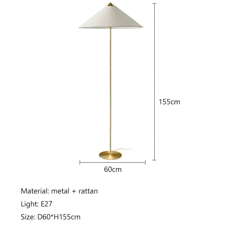 Vintage floor lamp with gold-toned metal frame and gubi rattan shade for elegant living room decorbites lighting