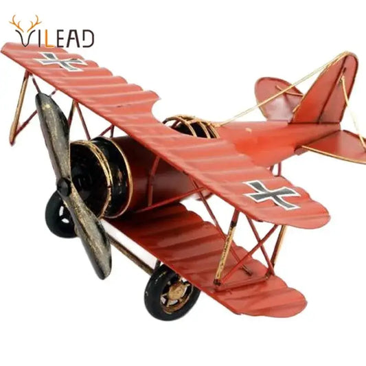 Vintage red iron airplane figurine with black and gold accents and white cross decor for bedroom decorbites iron airplane