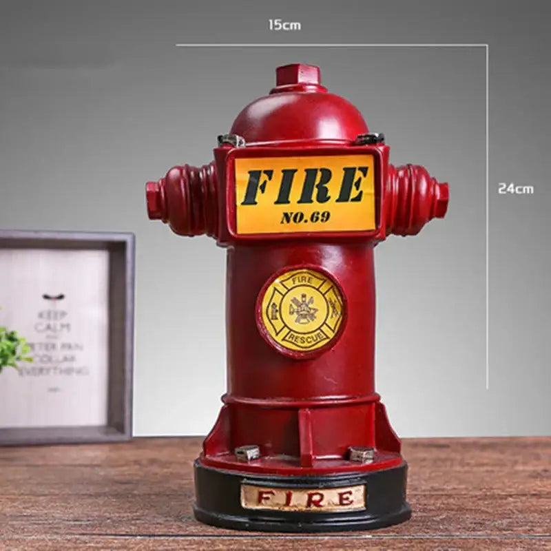 Vintage red and yellow hydrant piggy bank with fire no 69 plaque and gold inscribed black base for living room decor