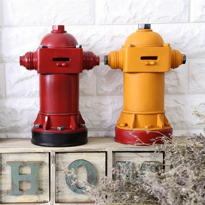 Vintage red and yellow hydrant piggy bank with painted metal finish for living room decor and coin storage